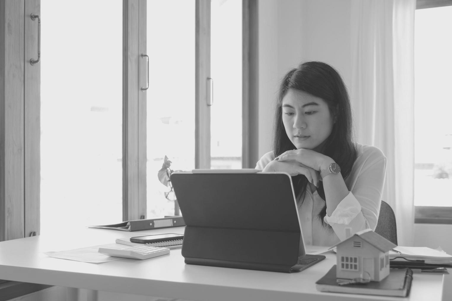 Modern office workspace with team members collaborating on API testing strategies using advanced monitoring tools