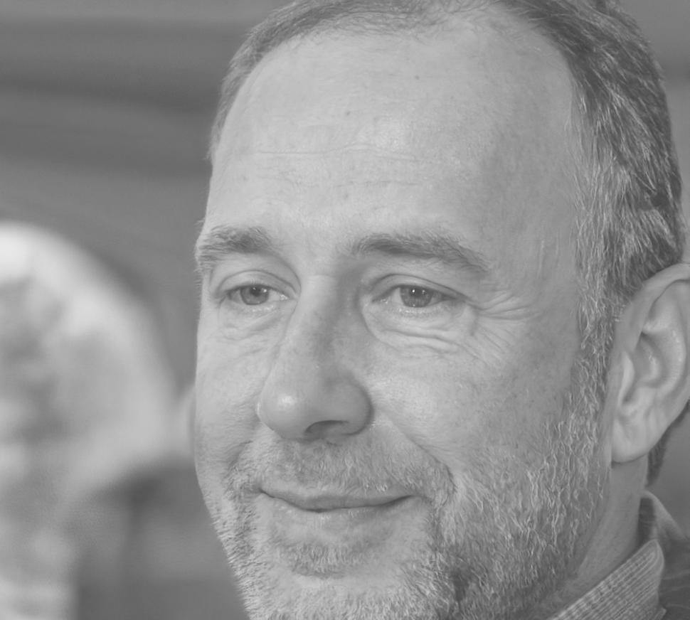 Senior technical specialist reviewing API testing results and system integration reports